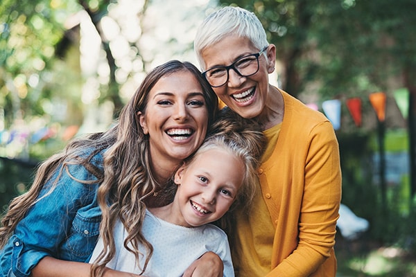 Family smiling at Valley Orthodontics in Decatur and Hartselle, AL